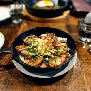 Belly Pot. Dry by itself cuz of all the unflavored rice but get hot sauce then you're good