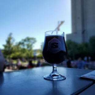 a glass of beer on a table