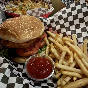 Fried chicken sandwich and nachos in back