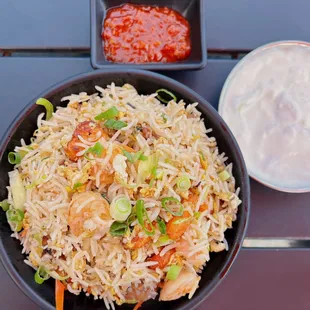 Burnt Garlic Fried Rice: Stir-fried rice w/ mixed vegetables, soy sauce, pepper, garlic | $12.99 + $3.5 shrimp + $1.5 egg + $2.49 raita