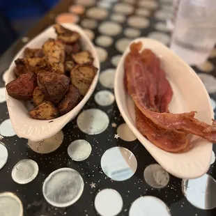 Home potatoes and a side of bacon. They give you 4 pieces of bacon, none under cooked. The potatoes are seasoned to perfection!