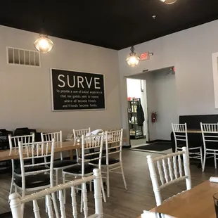 a dining room with tables and chairs