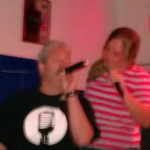 a man and a woman singing