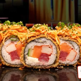 Sus Hi Roll! It's so good that we put our name on it, literally. Stuffed with tuna, salmon, crab, cream cheese, and cucumber. Tempura fried!