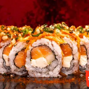 Try our Spicy Philly Roll! Salmon, cucumber, and cream cheese roll topped with spicy krab and mango habanero and sweet soy sauce!