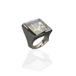 Stunning.....Very Fine Blue Moonstone 16.42 Carats, cut by Tom Munsteiner accented with 16 Round Brilliant Diamonds. Platinum.