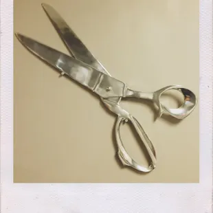 These aren't your usual hair scissors! These are on our walls. Come in and see!