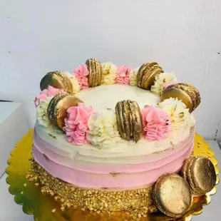 a cake with pink and white frosting