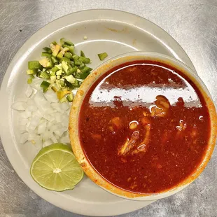 a bowl of chili and onions