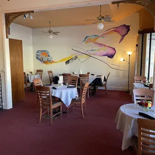 Dining area, with a mural from local tattoo artist