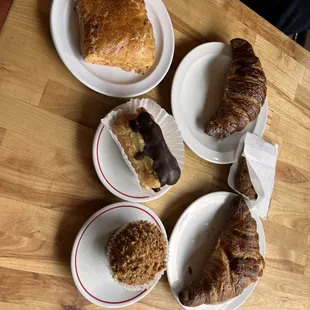 Assorted pastries. Scone, chocolate croissant, eclair, chocolate oatmeal cookie, banana nut muffin, croissant