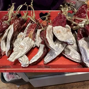 Dried red chile peppers painted by Susan's daughter for $10.