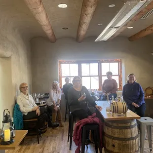 a group of people in a tasting room