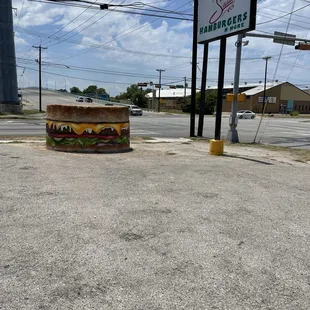 Burger sign in parking lot area at corner of Irving Blvd &amp; Wycliff