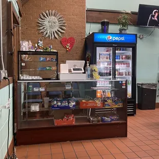 Cashier and cooler with drink options. Also some other random snack items available for purchase
