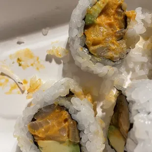three pieces of sushi on a plate