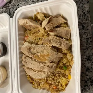 chicken and rice in a styrofoam container