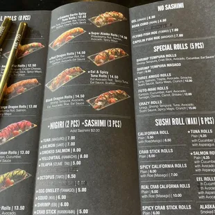 a menu and a pair of chopsticks