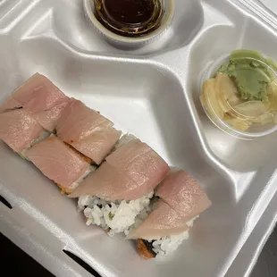 Presidential Roll - inside: spicy tuna and cucumber. Outiside: yellow fin tuna