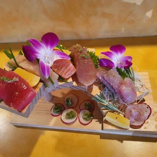 a variety of sushi on a cutting board