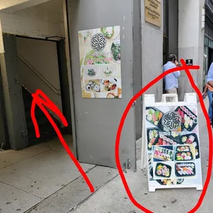 Look for this sign on the sidewalk and follow the stairs