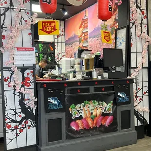 a sushi restaurant with cherry blossoms