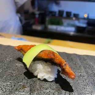 a close up of a sushi on a plate