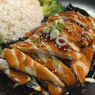 a plate of chicken, rice, and broccoli