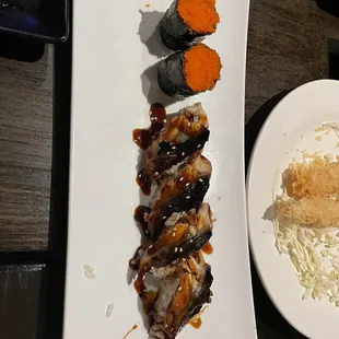 a plate of sushi and a bowl of rice