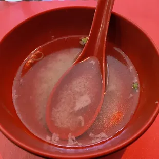 a bowl of soup with a spoon in it