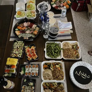 a table full of different types of sushi