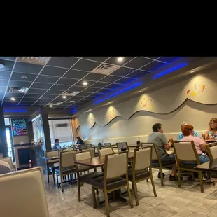 a group of people eating at a restaurant