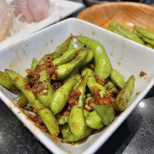 a close up of a bowl of green beans