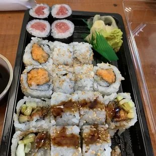 a tray of sushi on a table