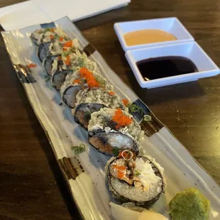 a plate of sushi on a table