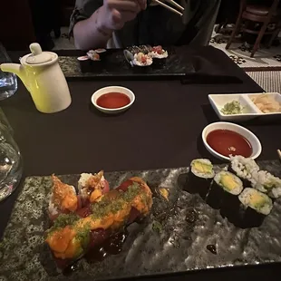 Left, Adam bomb roll, right avocado roll, plate across was salmon sushi and the island roll.