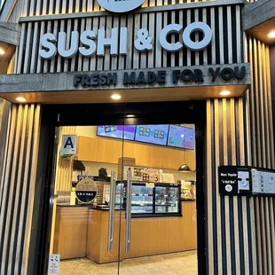 the entrance to the sushi and co