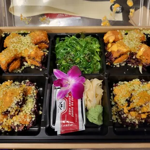 Mixed roll special -- spicy tuna and double spicy tuna with black rice and seaweed salad