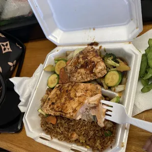 a meal in a styrofoam container