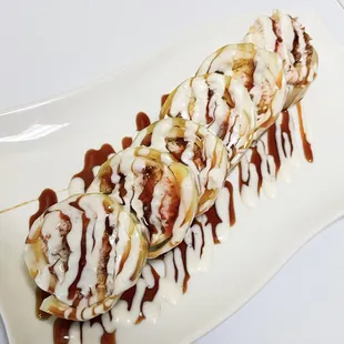 Johnny roll
 Inside: shrimp tempura, yum yum crab
 Outside: (cucumber wrapped) eel sauce, creamy sauce