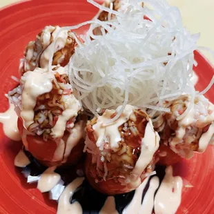 Salmon Tomato
 Inside: yum yum crab, avocado 
 Outside: (salmon wrapped) eel sauce, spicy mayo
