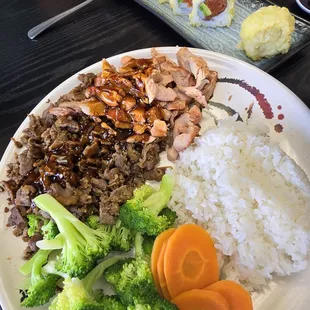 Chicken and beef teriyaki with steam vegetables plate.