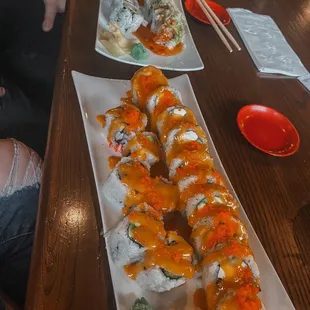 two plates of sushi on a table
