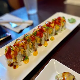 two plates of sushi on a table