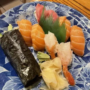 Assorted sushi and a salmon skin hand roll