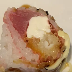 a piece of sushi on a white plate