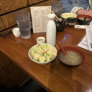 Salad with ginger dressing, miso soup, and peach sake