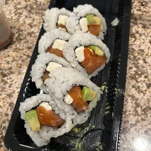 Phill roll - salmon , cream cheese , avocado .  Came with ginger and wasabi