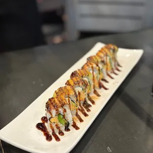 a long plate of sushi