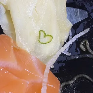 a close up of a plate of sushi